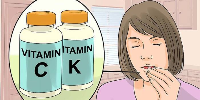 Menina toma vitaminas
