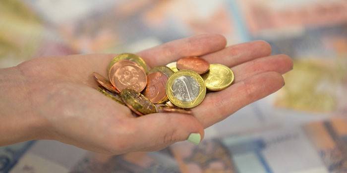 Moedas na palma da sua mão