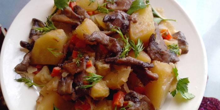 Asado con verduras, champiñones y papas