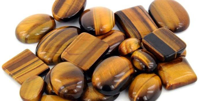 Ošetrené kamene rôznych tvarov Tiger's Eye
