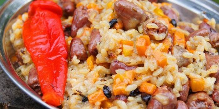 Corazones de pollo con arroz y verduras.