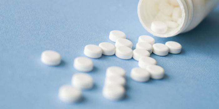 Pastillas en un frasco de polímero