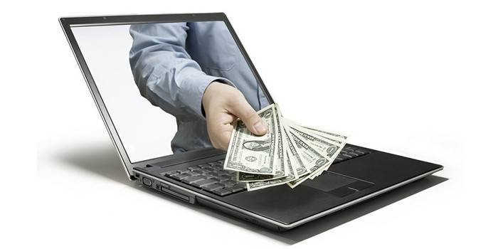 Laptop e homem com dinheiro na mão