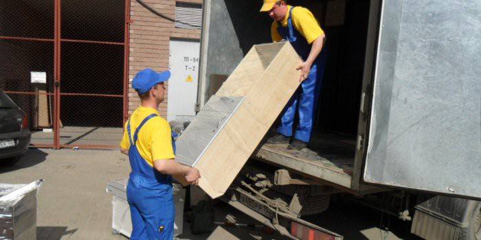 Movers load furniture