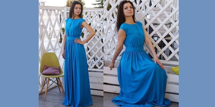 Dievča v modrých elegantných šatách na podlahe